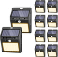 SEZAC Solar Lights Outdoor, 10 Pack Solar Motion Sensor Outdoor Lights with 3 Lighting Modes, IP65 Waterproof Solar Fence Lights for House (Warm White)